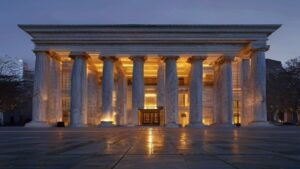 Imposing neoclassical central bank building with tall marble columns and bronze doors